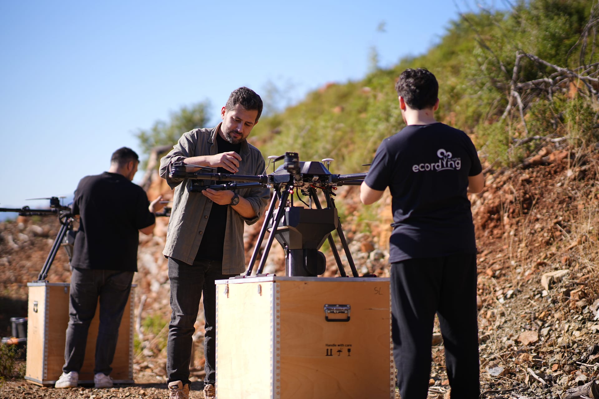 Team working with drone equipment in the field