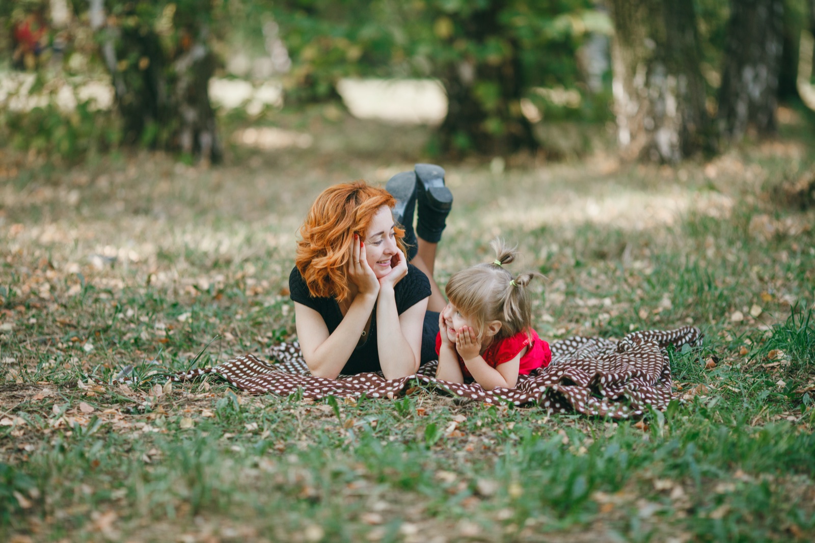 A parent and child talking about climate and nature